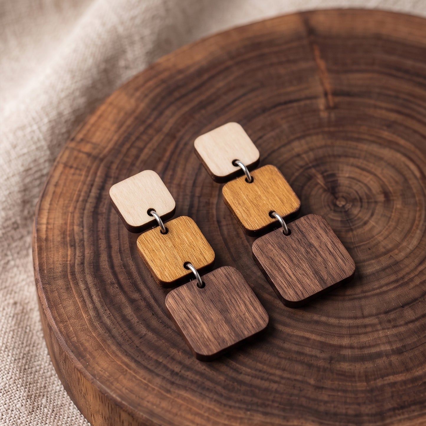 Three-tier ombre wooden square dangle earrings in natural wood tones, handmade by Mekala Crafts