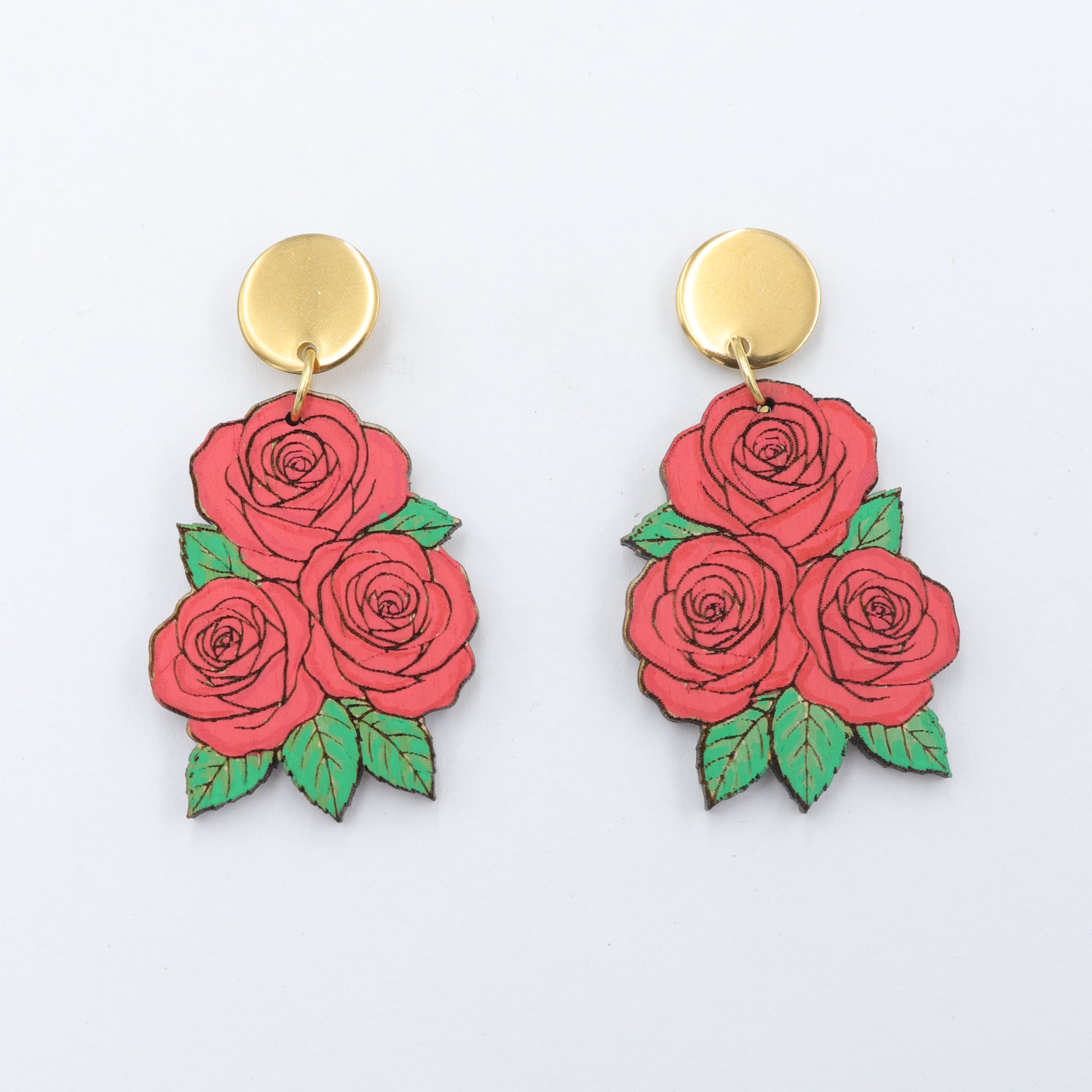 Rose-shaped earrings with gold posts on a white background