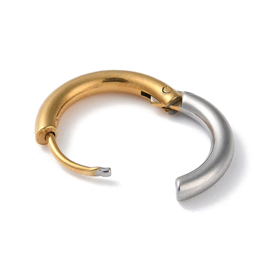 A two-tone metal cuff earring in polished gold and silver, shown on a clean white background.
