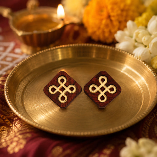 Festive kolam-inspired wooden stud earrings with gold knot design, handmade by Mekala Crafts
