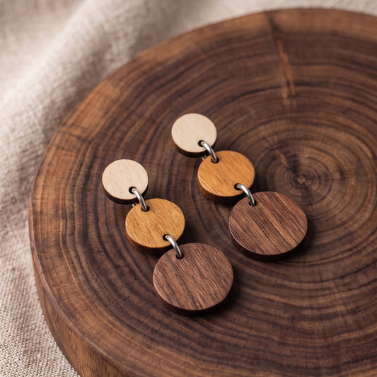 Three-tier ombre wooden circle dangle earrings in natural wood tones, handmade by Mekala Crafts
