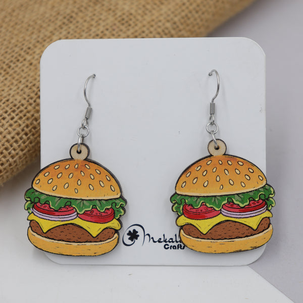 Hand-painted wooden cheeseburger dangle earrings with sesame bun, lettuce, tomato and cheese, handmade by Mekala Crafts