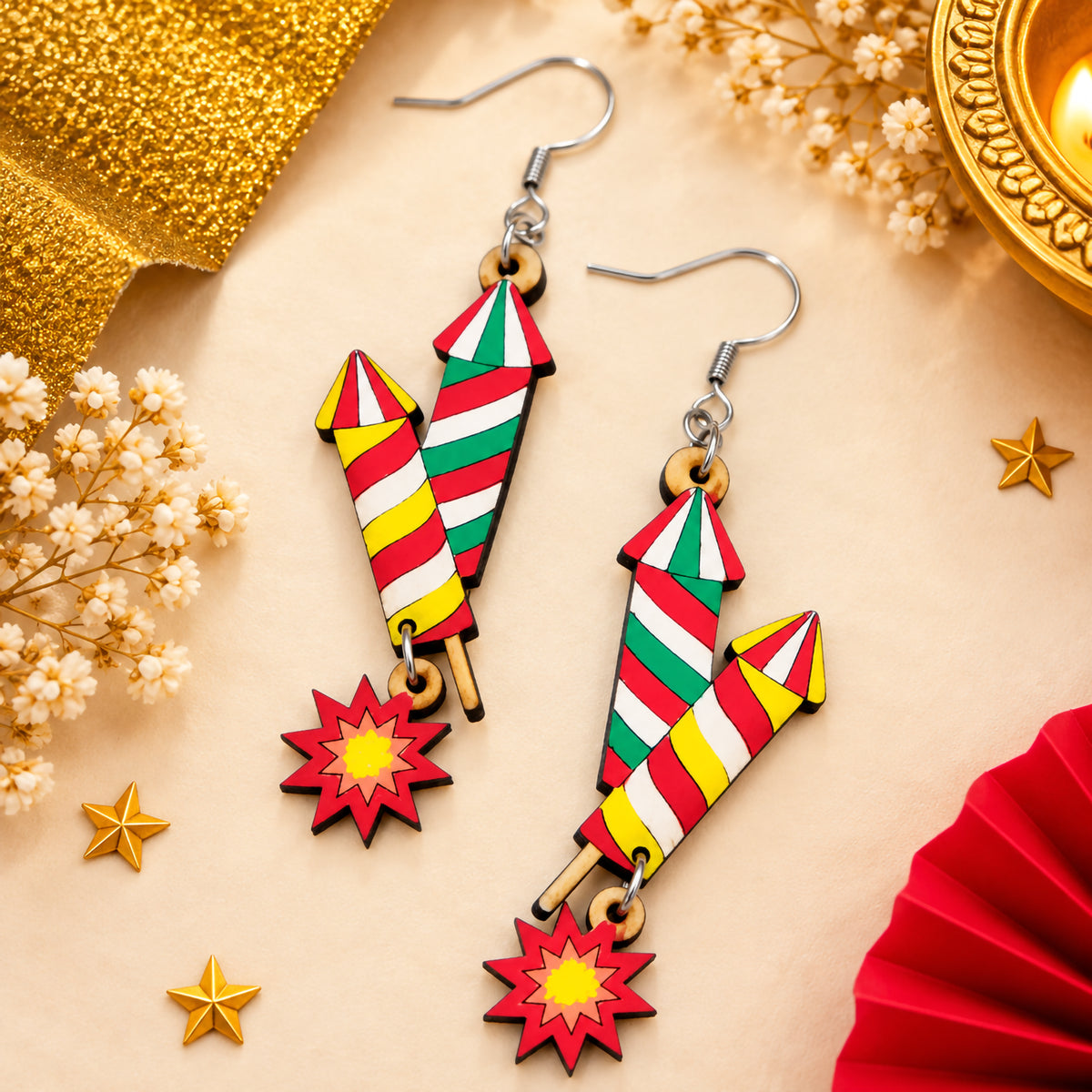 Colorful hand-painted wooden double rocket earrings with red, white, green and yellow stripes and red starburst charms.