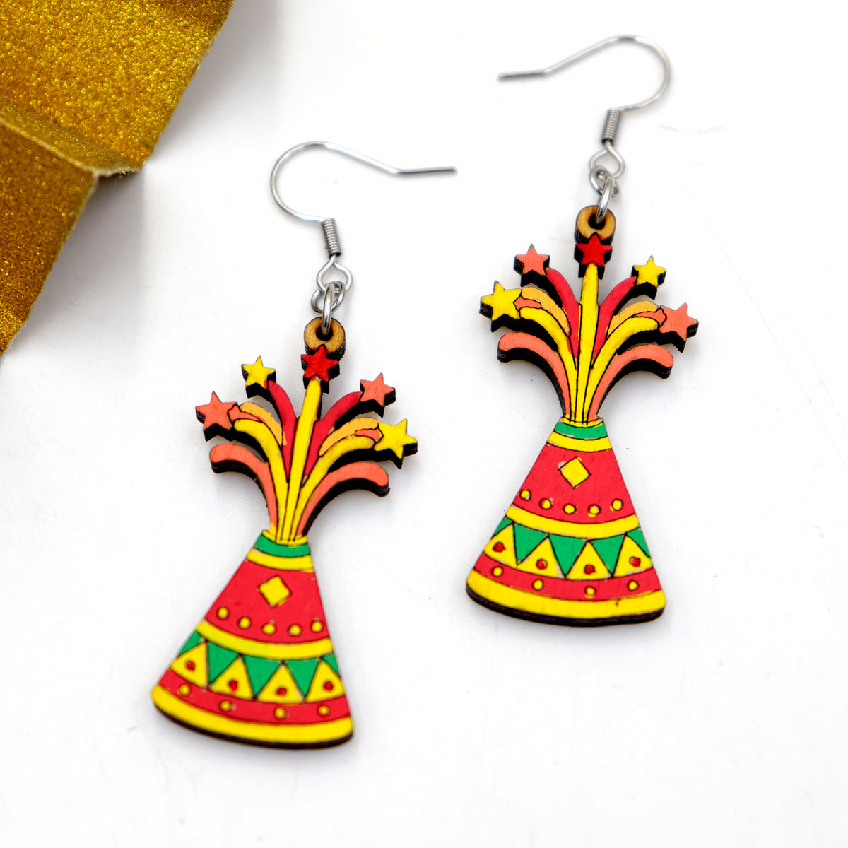 Hand-painted wooden Diwali flower pot anar cracker dangle earrings with colorful patterns and star sparks, handmade by Mekala Crafts