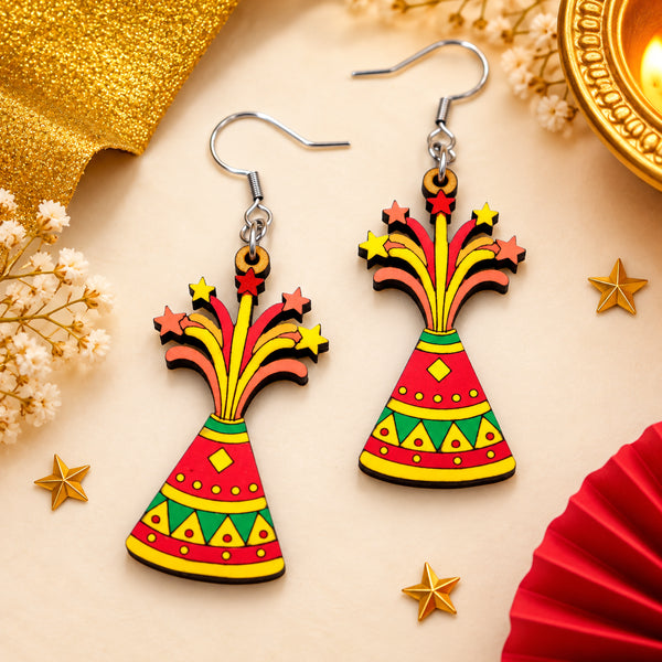 Hand-painted wooden Anar flower pot cracker earrings with colorful red, yellow and green patterns and star-shaped fireworks.