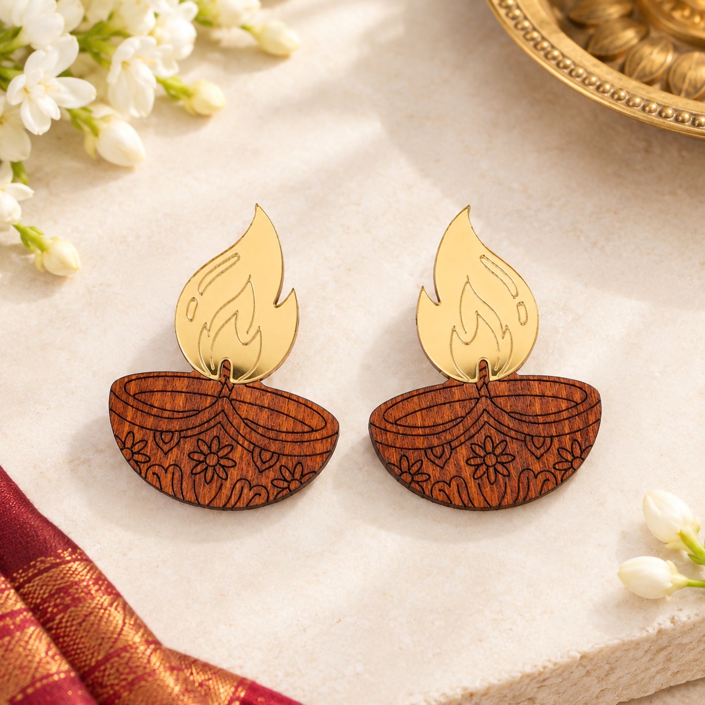 Wooden diya lamp earrings with gold acrylic flame and floral engraving, festive Diwali jewelry by Mekala Crafts