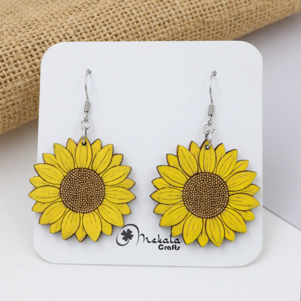 Yellow sunflower wooden dangle earrings with detailed brown center, hand-painted, handmade by Mekala Crafts